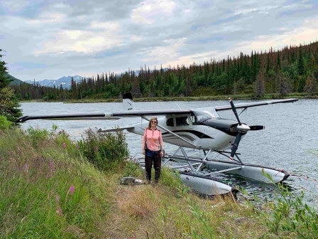 Ashleigh Oliver in front of a plane