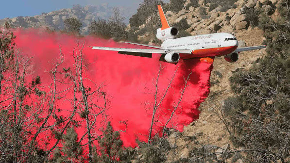 plane releasing firefighting agent