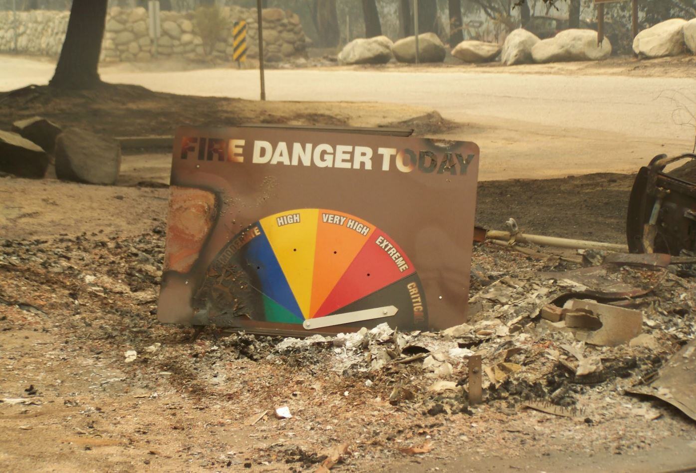 broken fire danger sign on the ground