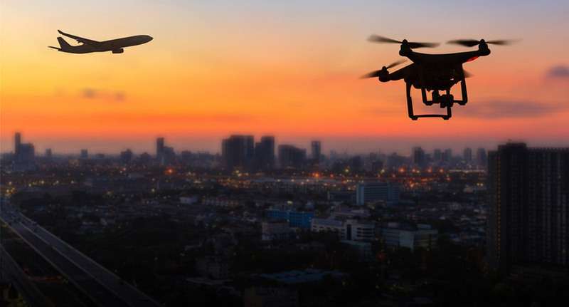 plane and drone in the sky